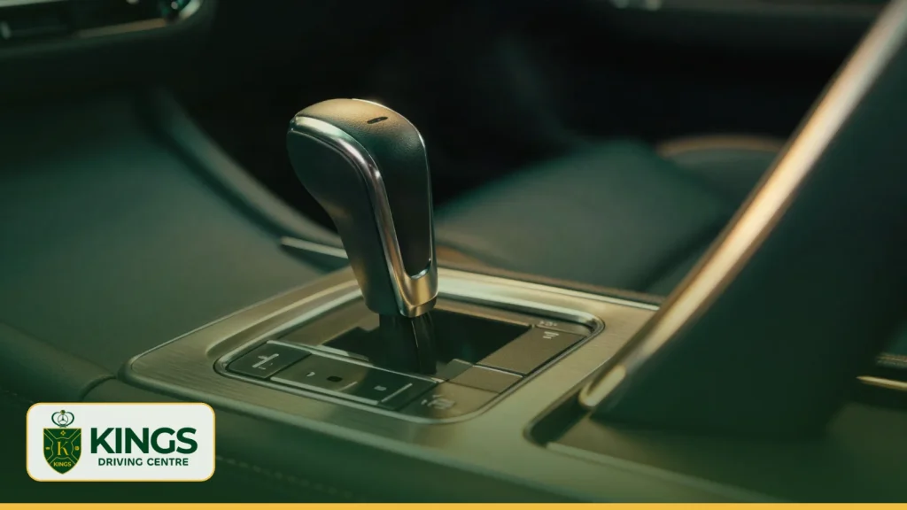 Hand resting on a car gear lever