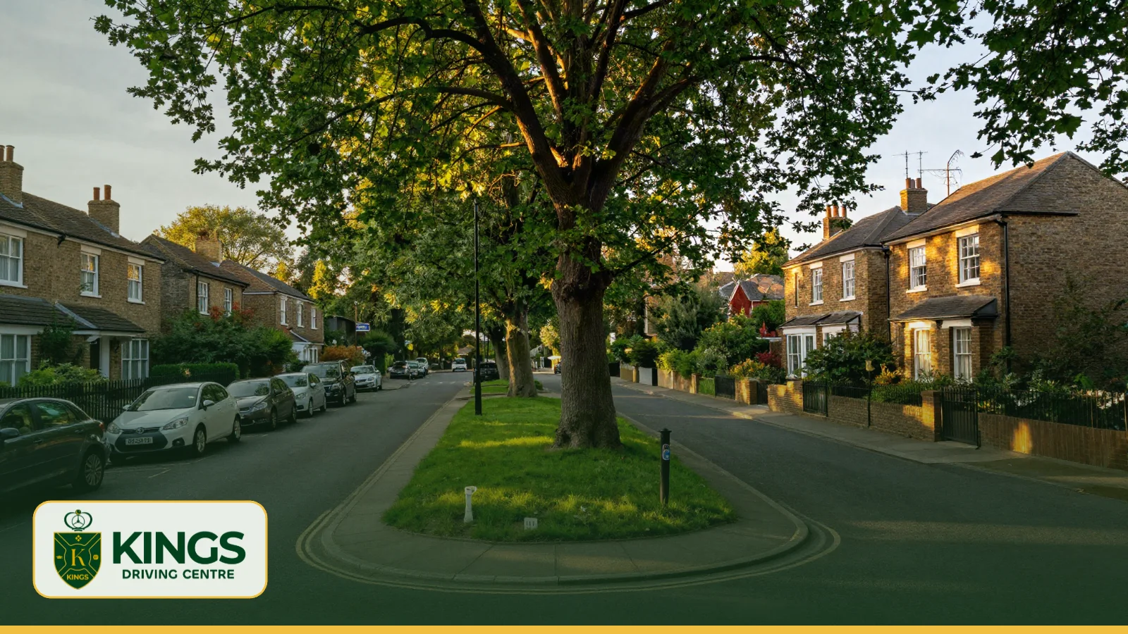 Suburban road forking around a green island in south-west London